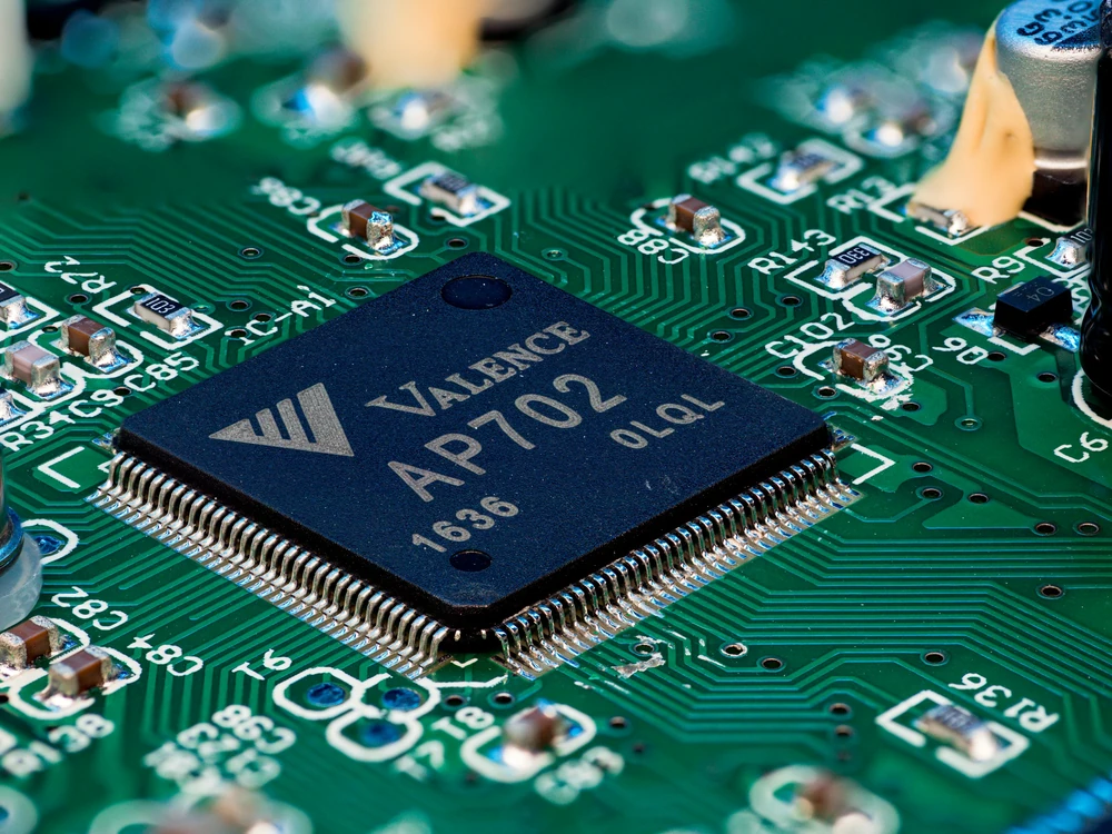 A processor with electronic connections on a printed circuit board.