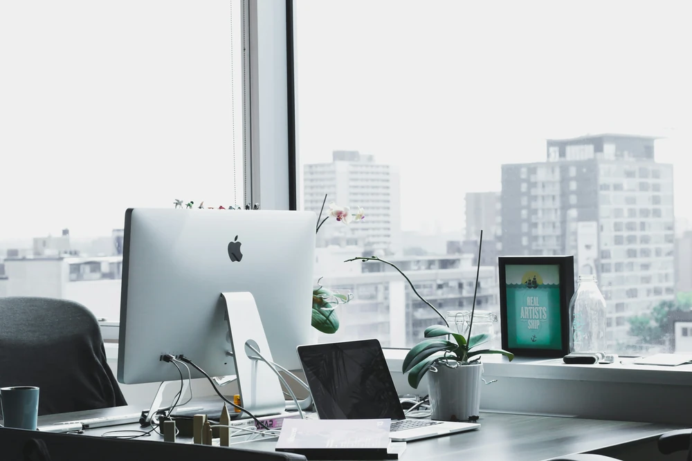 A bright office environment with workstations.