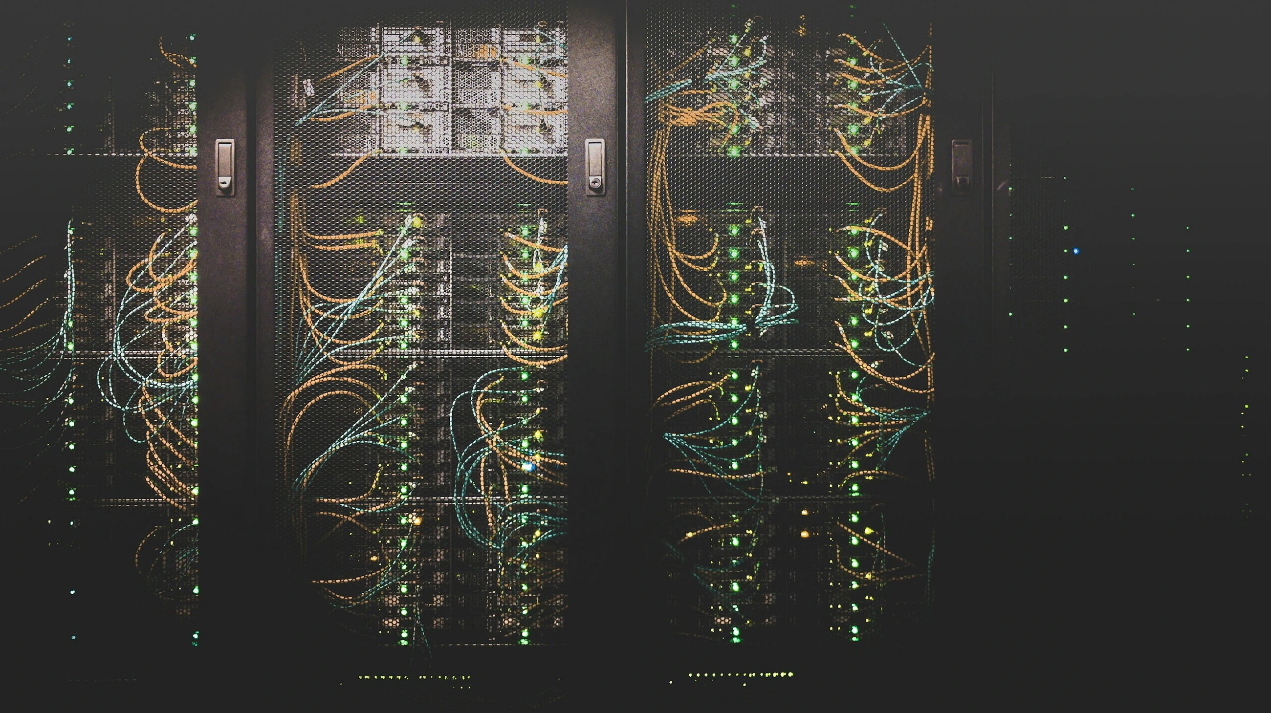 Server racks containing network equipment in a data centre.