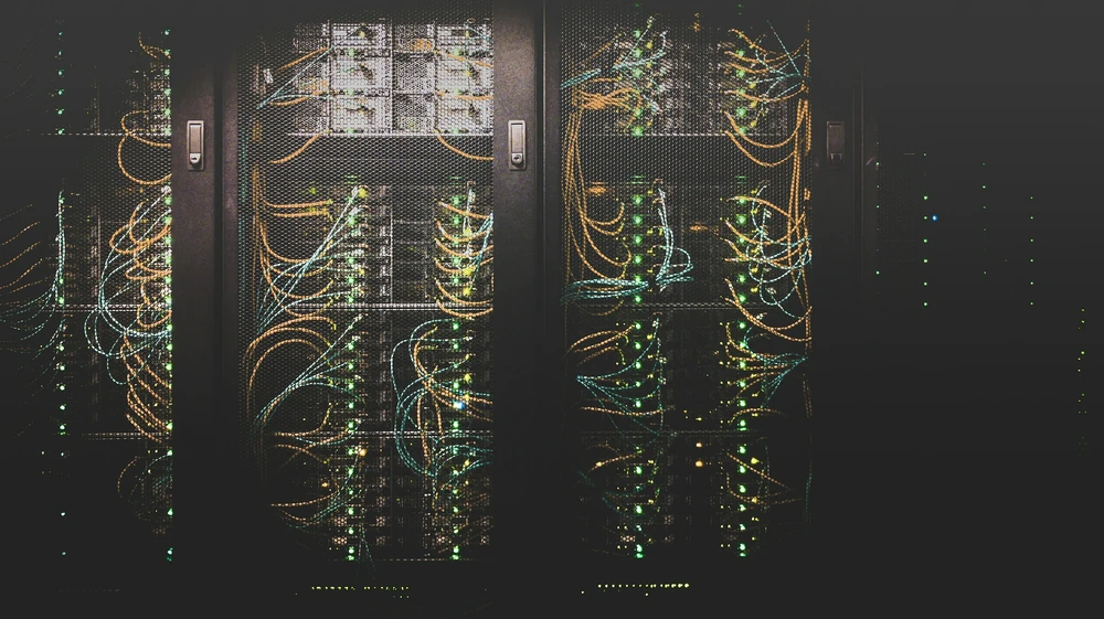 Server racks containing network equipment in a data centre.